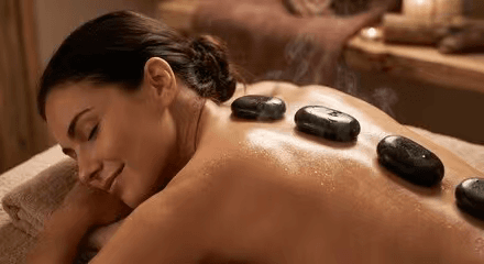 Woman relaxing during a hot stone massage